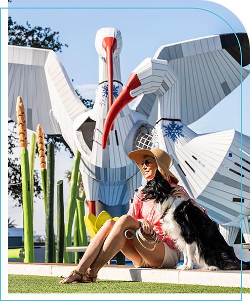 Lady seating by the Bird Art